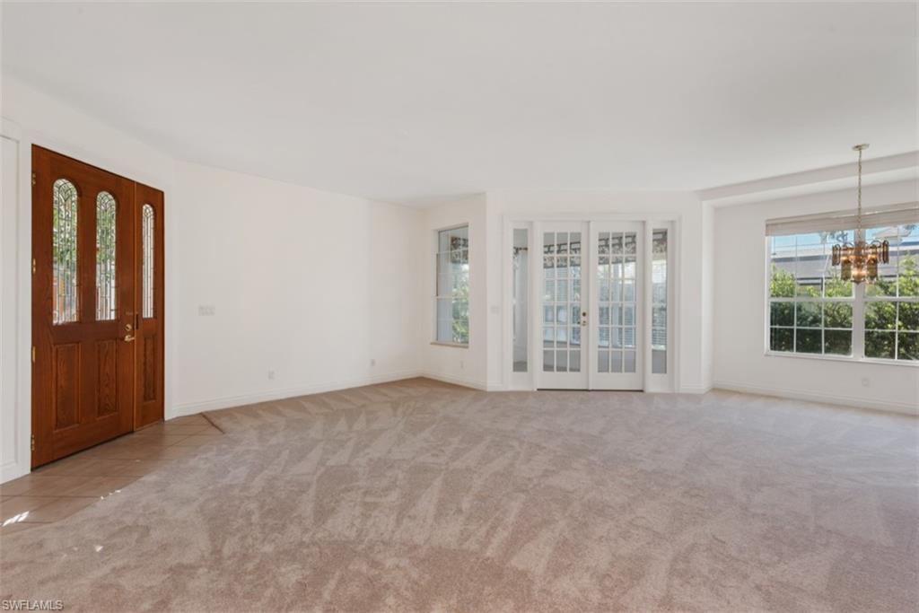 133 Colonade Circle Naples, FL 34103 - Photo 5 of 24 an empty room with windows