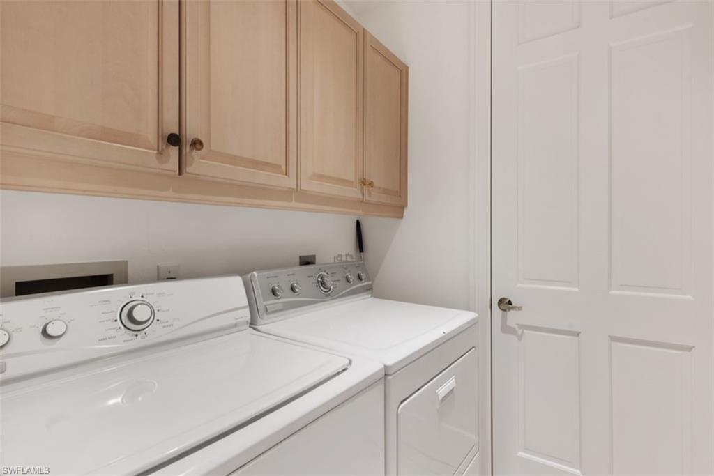133 Colonade Circle Naples, FL 34103 - Photo 8 of 24 a utility room with dryer and washer