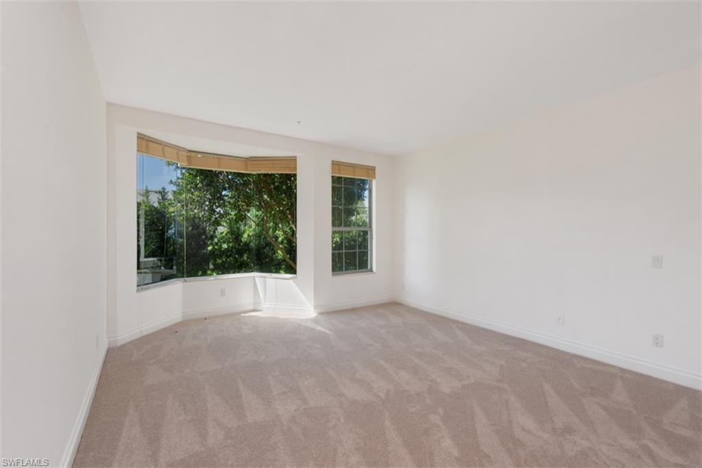 133 Colonade Circle Naples, FL 34103 - Photo 9 of 24 a view of an empty room with window