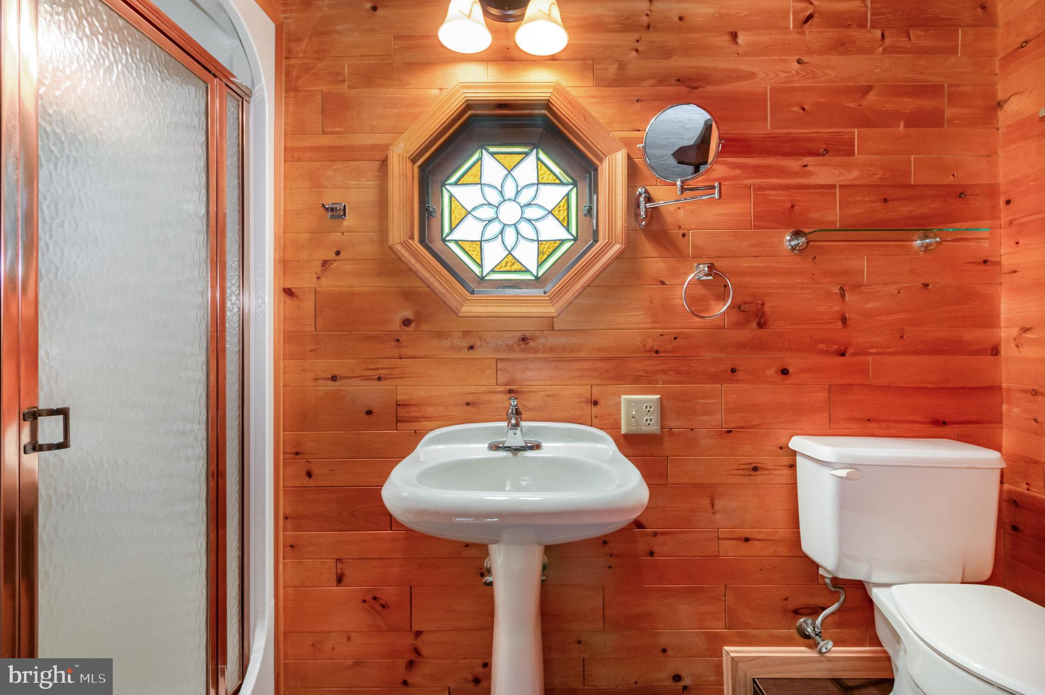1327 Baltimore Road Shippensburg, PA 17257 - Photo 13 of 57 a bathroom with a toilet sink and mirror