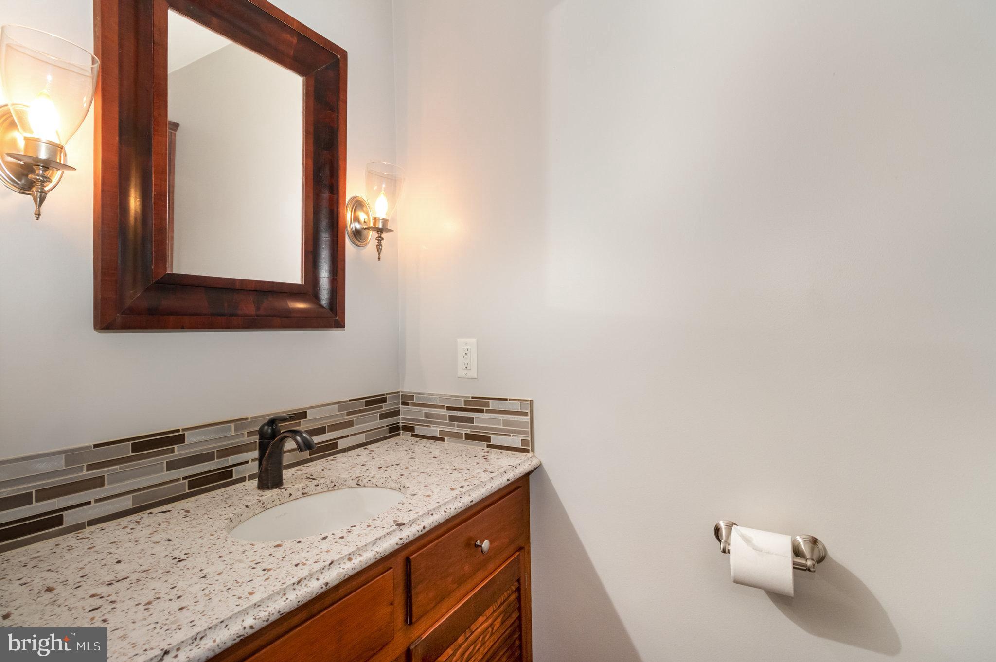 1327 Baltimore Road Shippensburg, PA 17257 - Photo 14 of 57 a bathroom with a granite countertop sink and a mirror