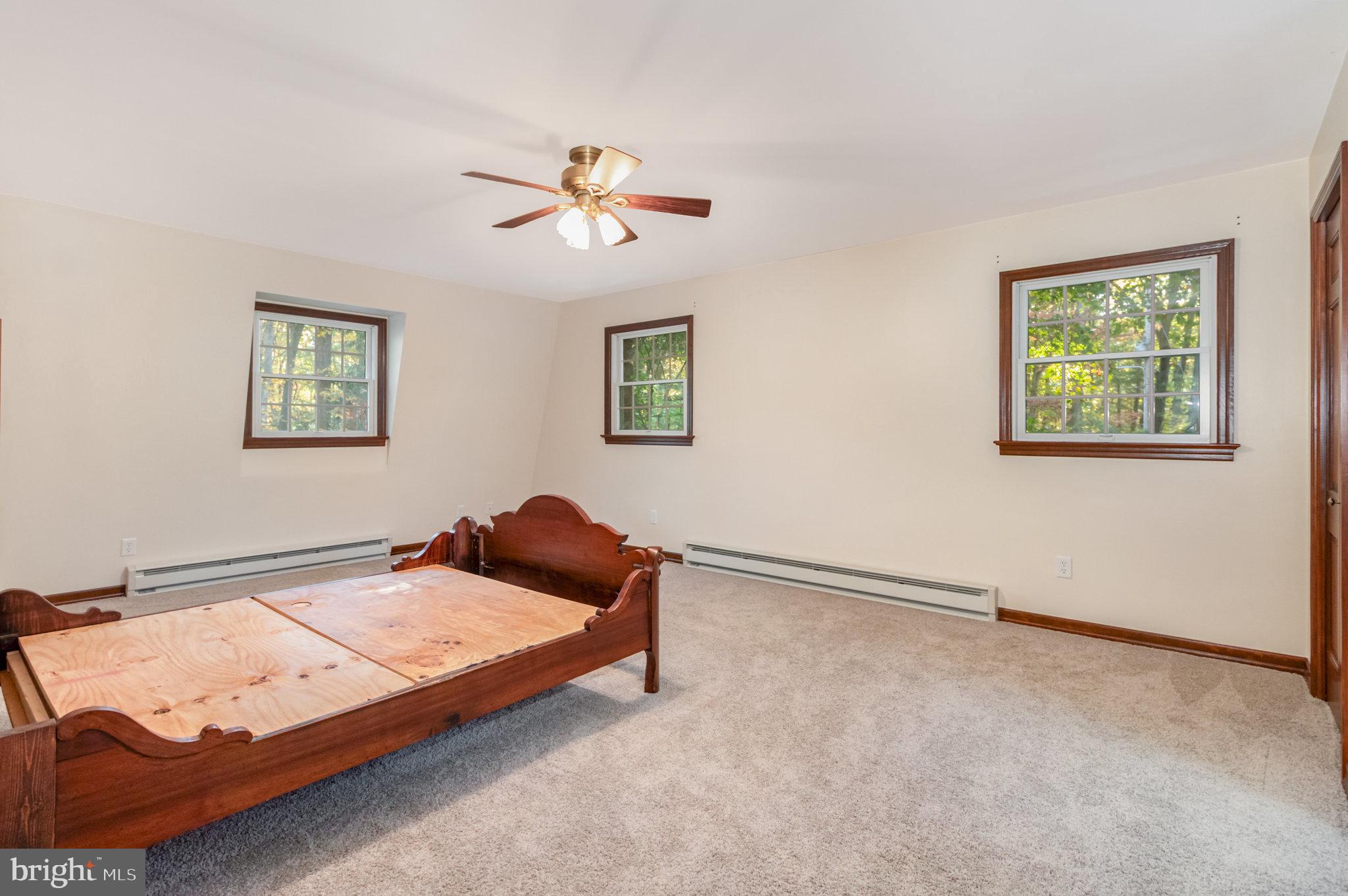 1327 Baltimore Road Shippensburg, PA 17257 - Photo 15 of 57 a bedroom with a bed and a window