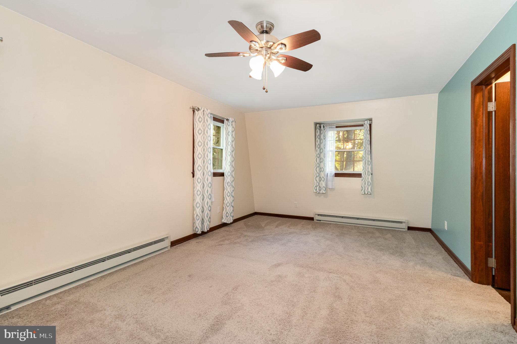 1327 Baltimore Road Shippensburg, PA 17257 - Photo 17 of 57 an empty room with windows and fan
