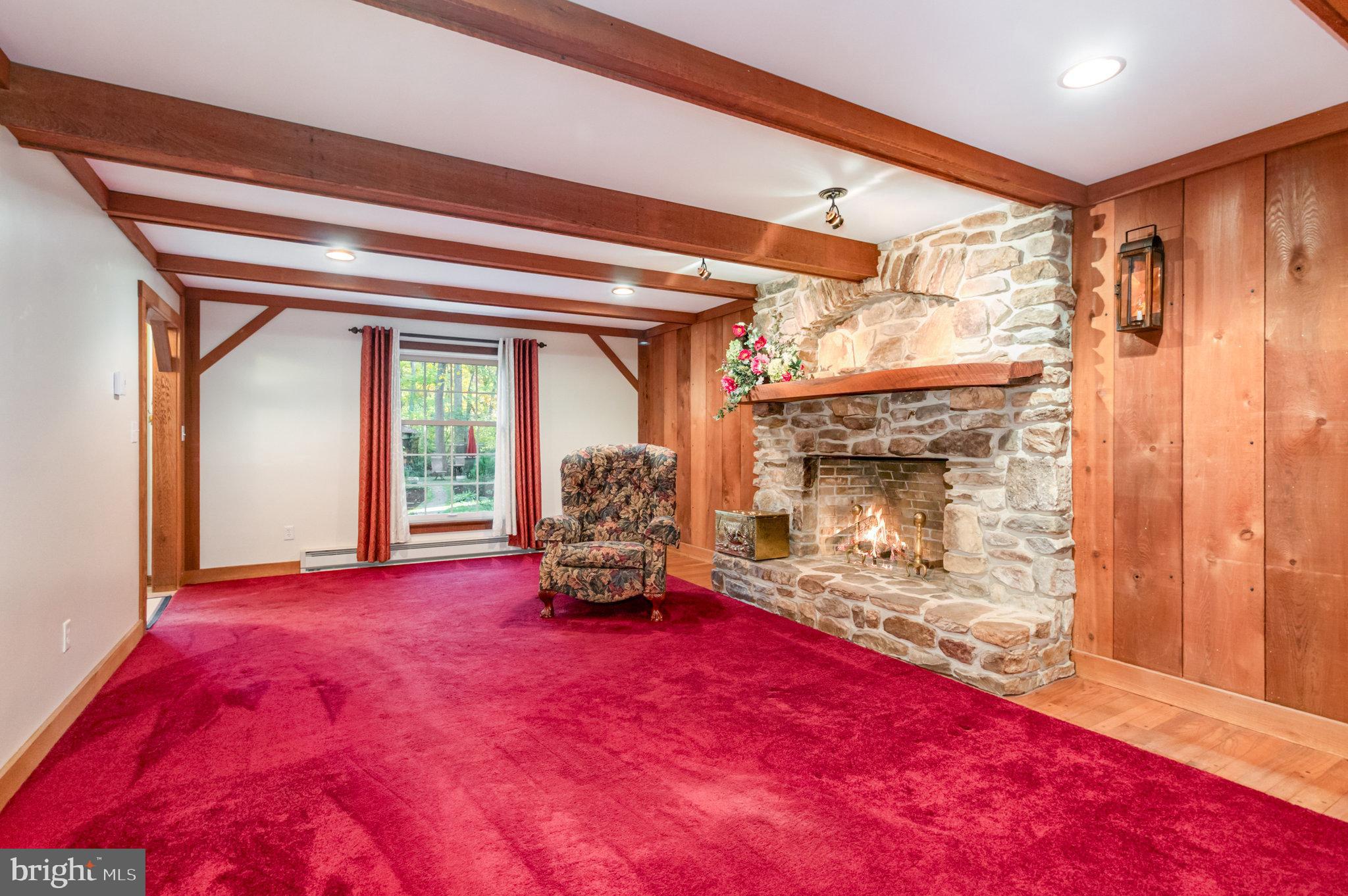 1327 Baltimore Road Shippensburg, PA 17257 - Photo 4 of 57 a view of empty room with wooden floor and fireplace