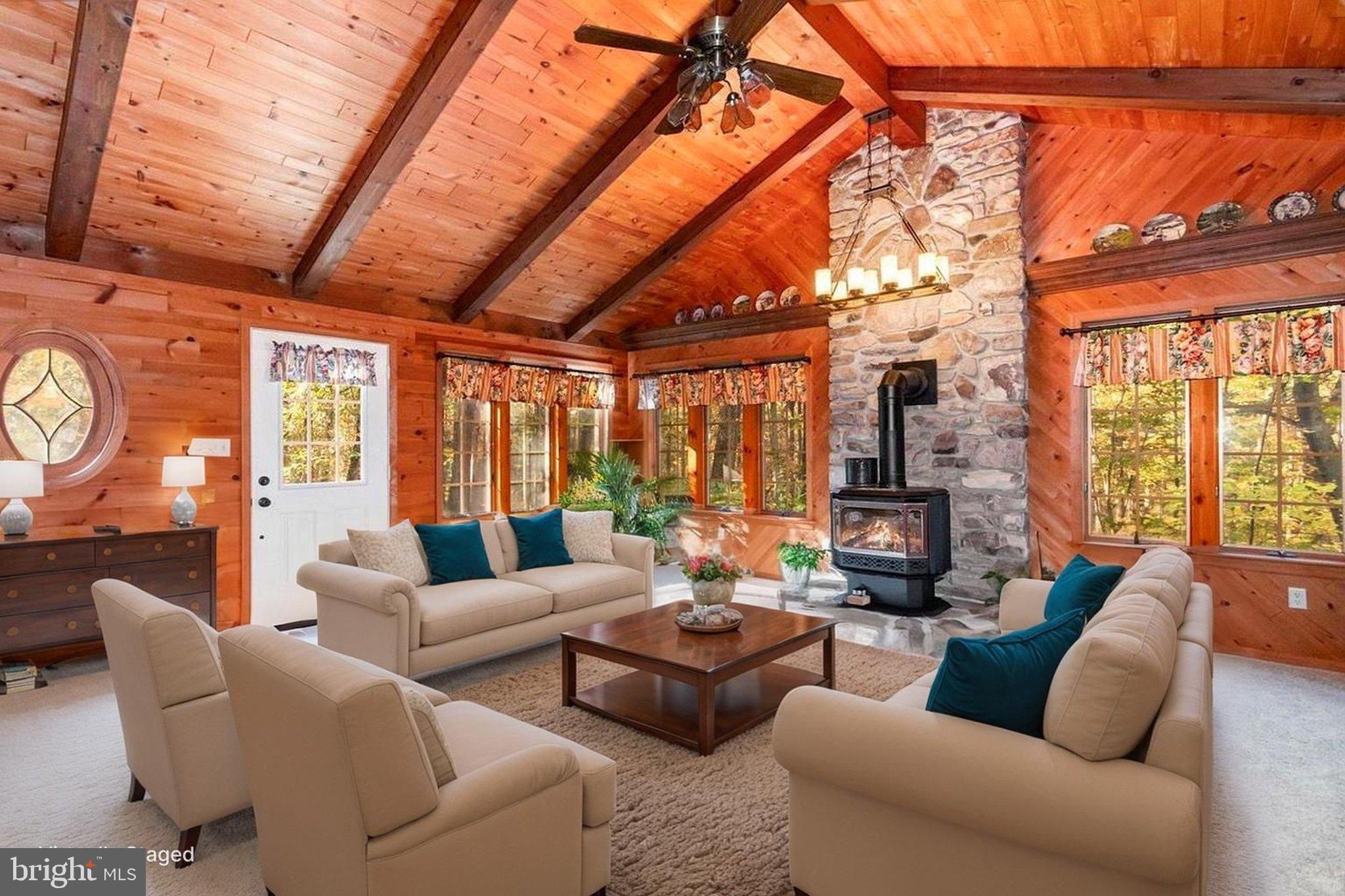 1327 Baltimore Road Shippensburg, PA 17257 - Photo 6 of 57 a living room with furniture a large window and a flat screen tv