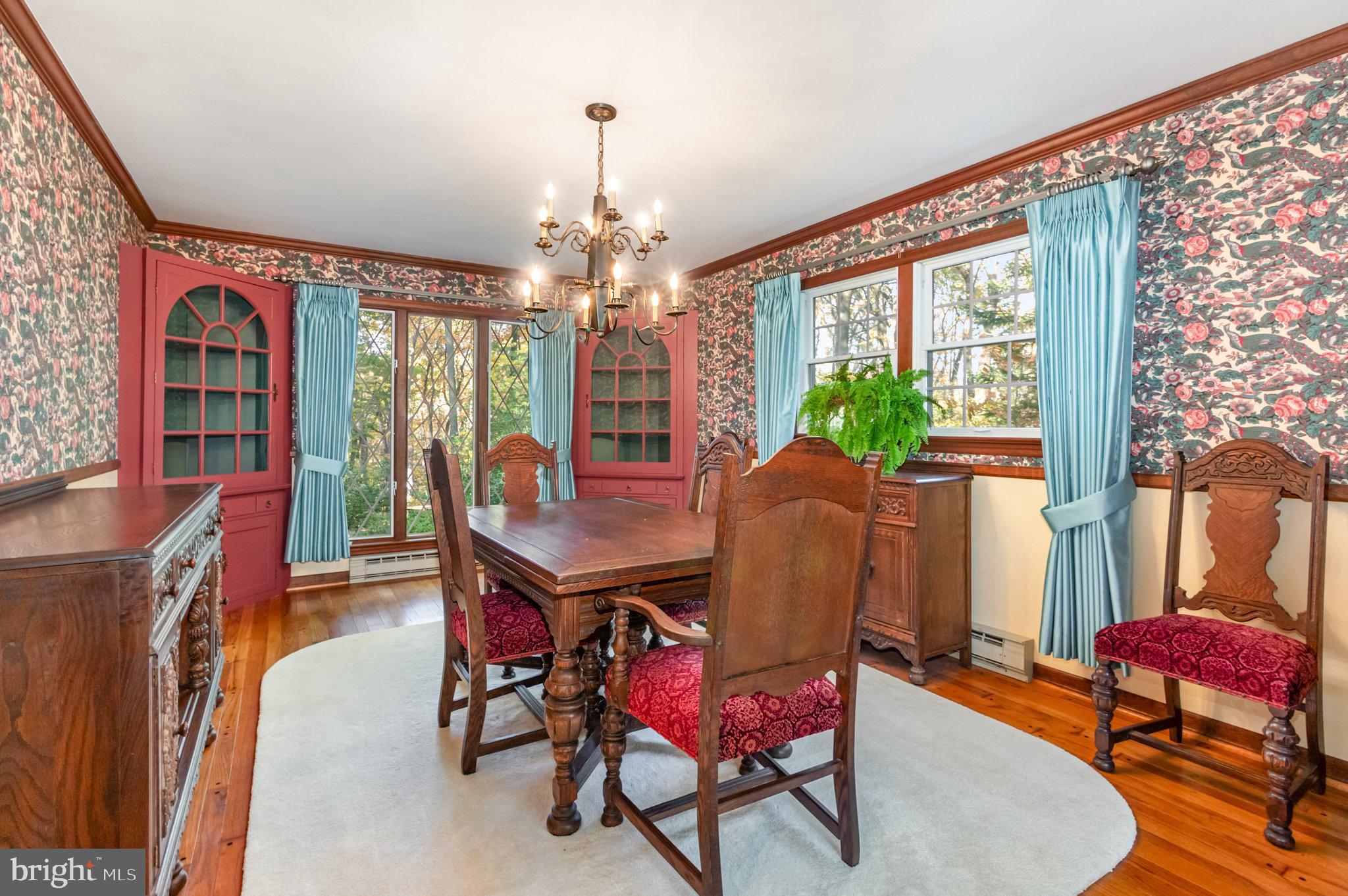 1327 Baltimore Road Shippensburg, PA 17257 - Photo 9 of 57 a view of a dining room with furniture a chandelier and wooden floor
