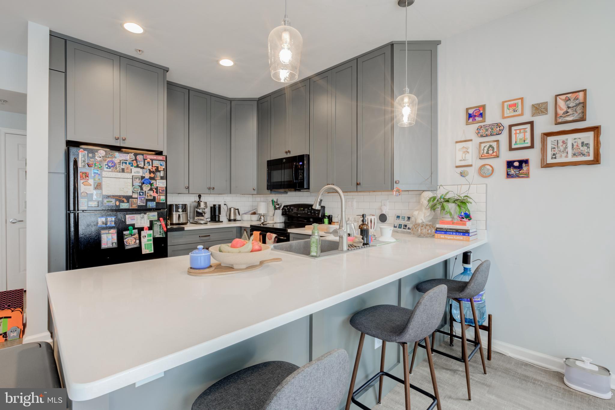 134 Bridge Street, Unit 201 Phoenixville, PA 19460 - Photo 13 of 33 a kitchen with a sink cabinets and window
