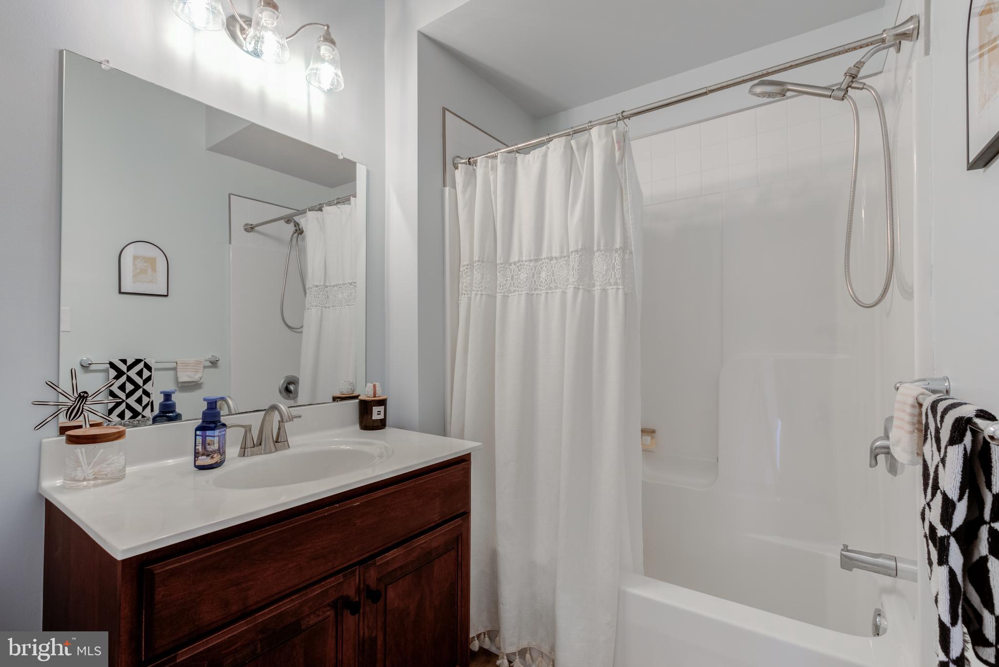 134 Bridge Street, Unit 201 Phoenixville, PA 19460 - Photo 21 of 33 a bathroom with a sink vanity tub and shower