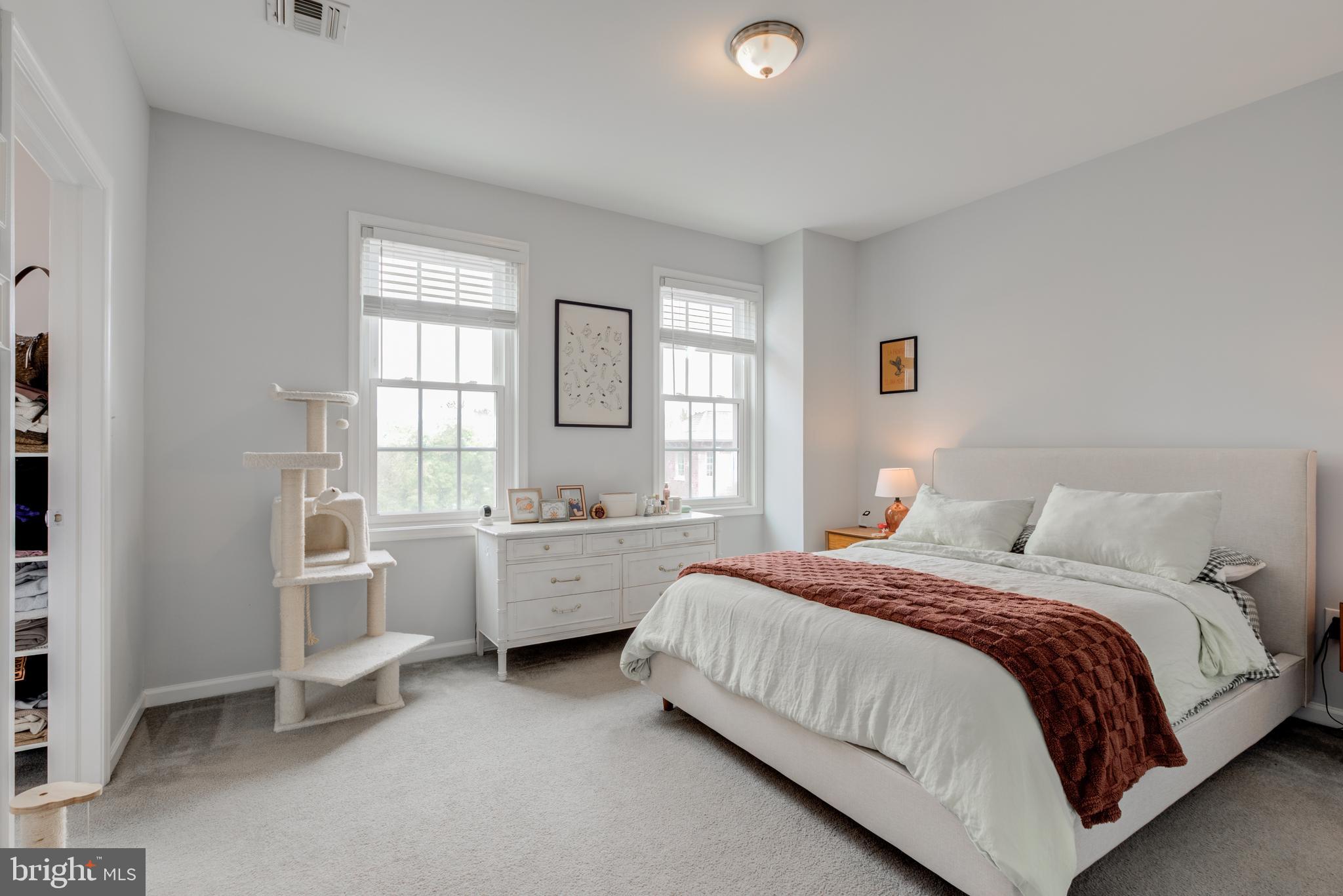 134 Bridge Street, Unit 201 Phoenixville, PA 19460 - Photo 23 of 33 a bedroom with a bed and a window