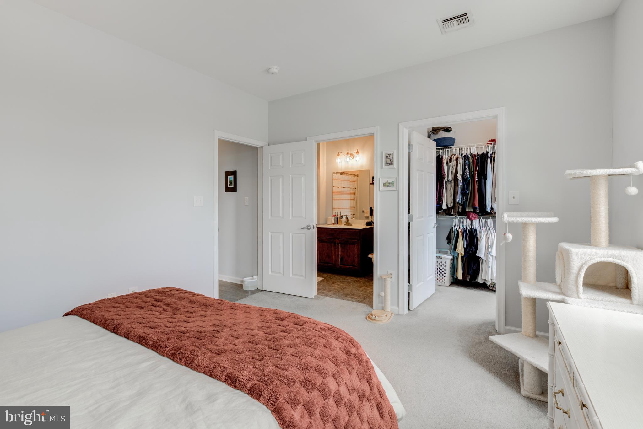 134 Bridge Street, Unit 201 Phoenixville, PA 19460 - Photo 25 of 33 a bedroom with a bed and a view of living room