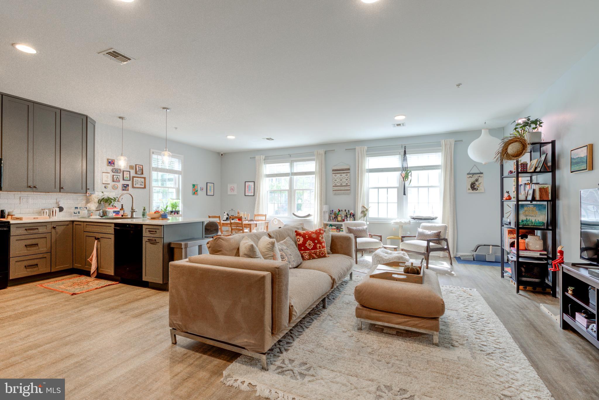 134 Bridge Street, Unit 201 Phoenixville, PA 19460 - Photo 4 of 33 a living room with furniture and wooden floor