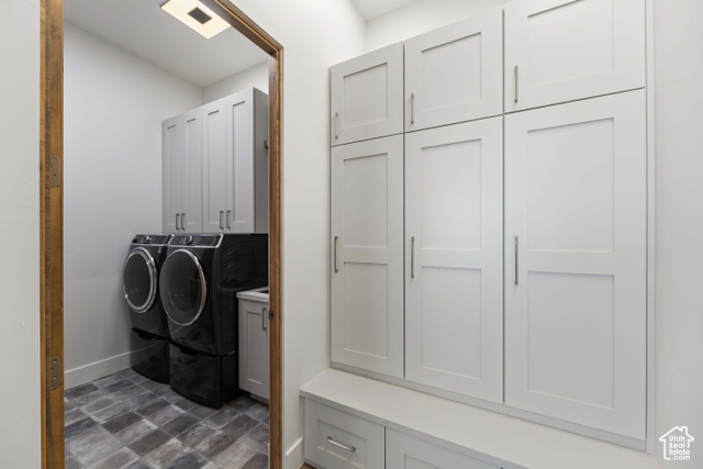 3558 South Cypress Road Hurricane, UT 84737 - Photo 17 of 57 Laundry area with cabinets, dark tile flooring, and washer and clothes dryer