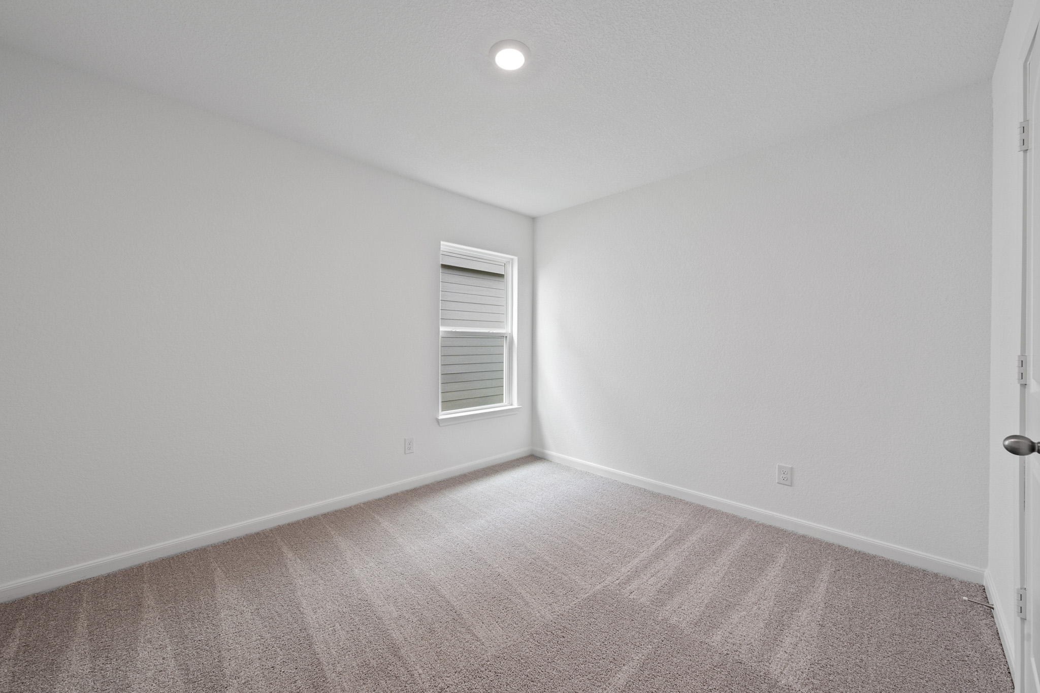 402 Aplite Pass Maxwell, TX 78656 - Photo 4 of 6 Empty room featuring light colored carpet and baseboards