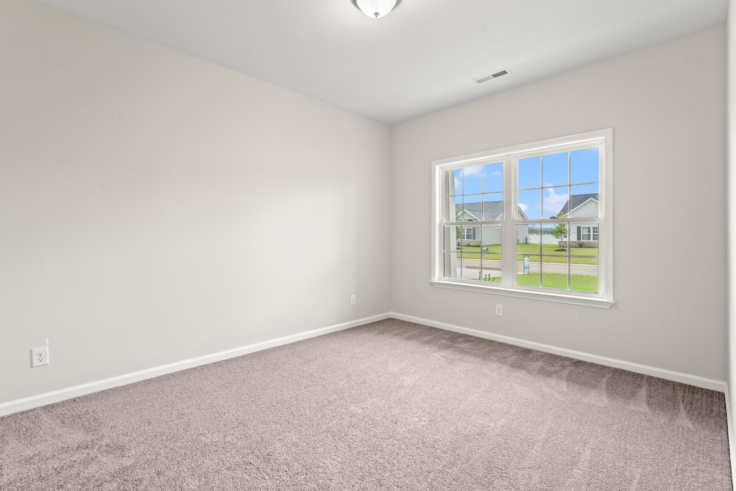 219 Stillbrook Drive Longs, SC 29568 - Photo 12 of 33 Carpeted spare room with baseboards