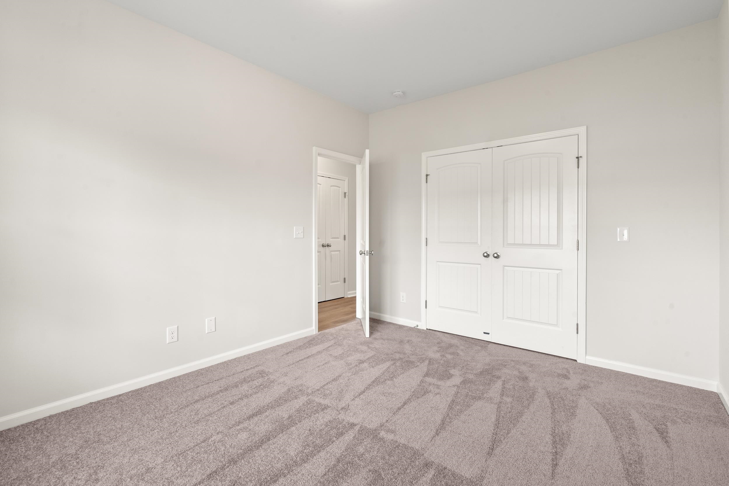 219 Stillbrook Drive Longs, SC 29568 - Photo 13 of 33 Unfurnished bedroom featuring carpet and a closet