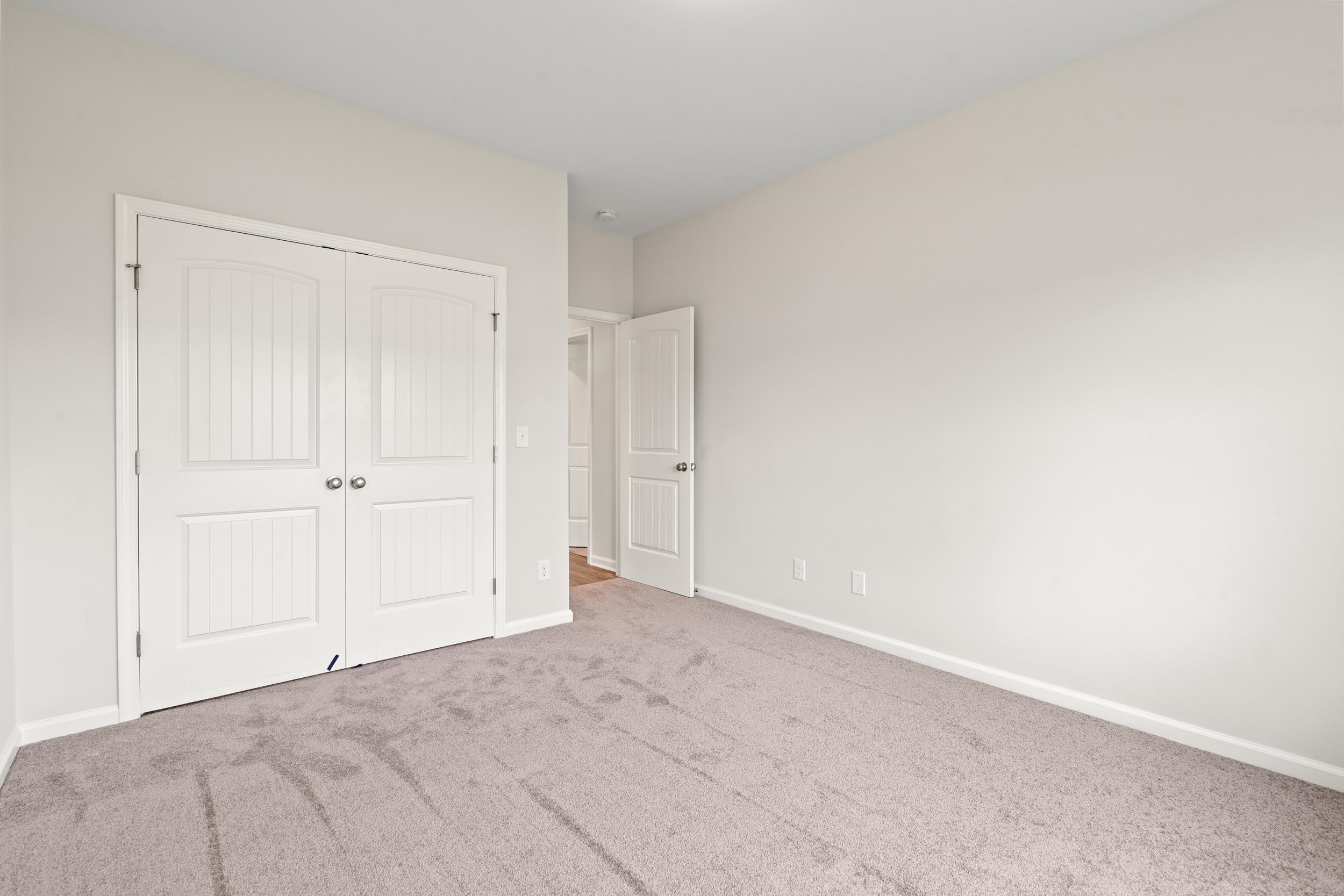 219 Stillbrook Drive Longs, SC 29568 - Photo 15 of 33 Unfurnished bedroom featuring carpet flooring and a closet
