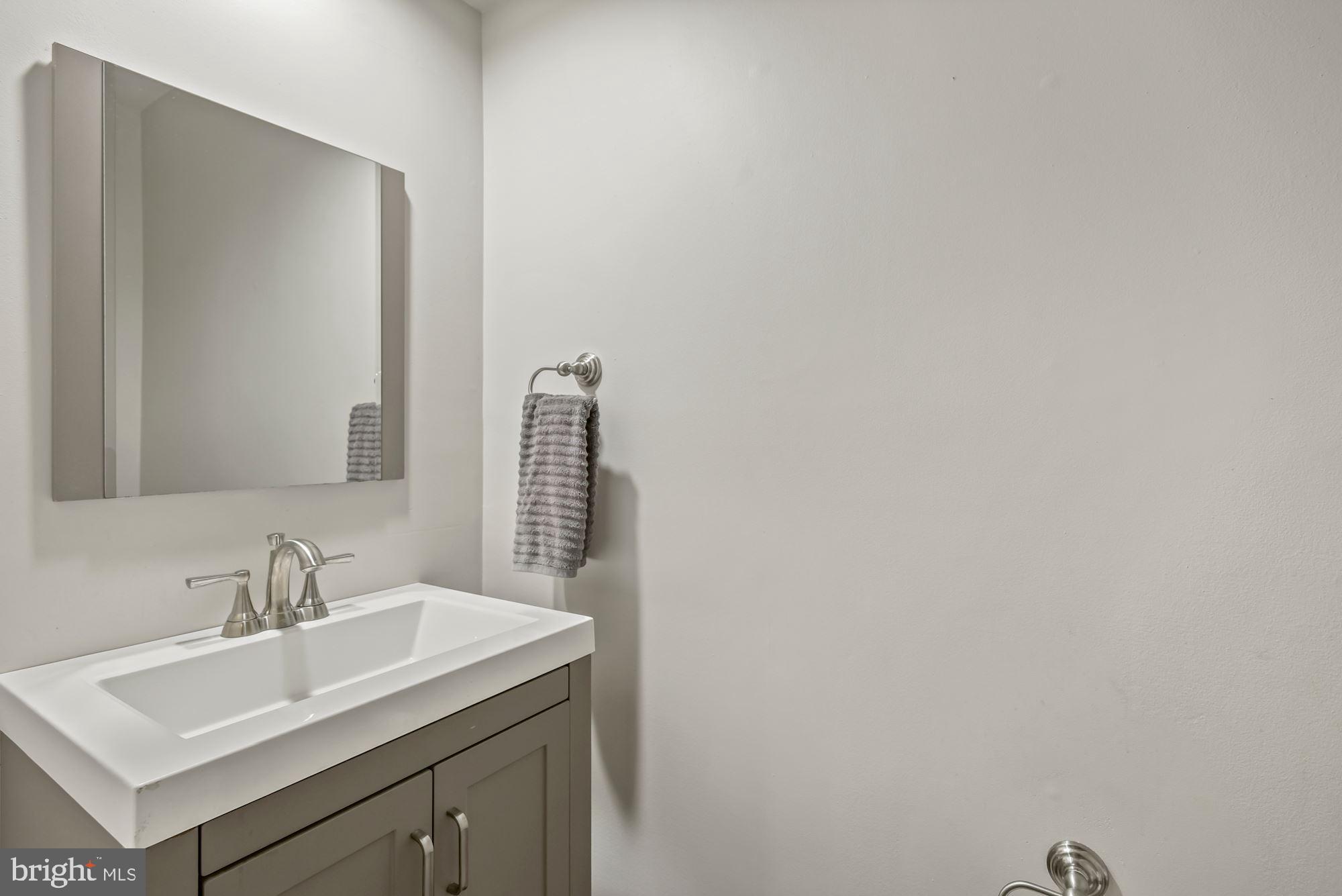 20121 Crew Square Ashburn, VA 20147 - Photo 11 of 36 a bathroom with a sink and a mirror