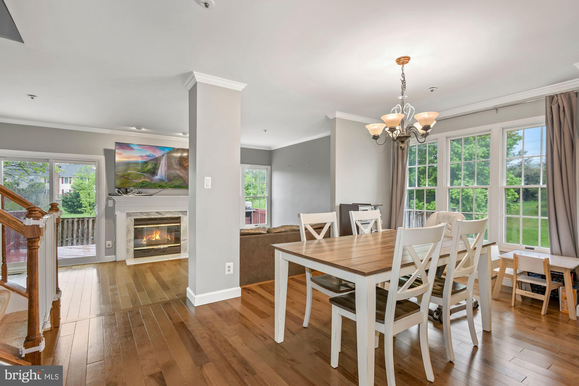 20121 Crew Square Ashburn, VA 20147 - Photo 12 of 36 a view of a dining room with furniture window and wooden floor