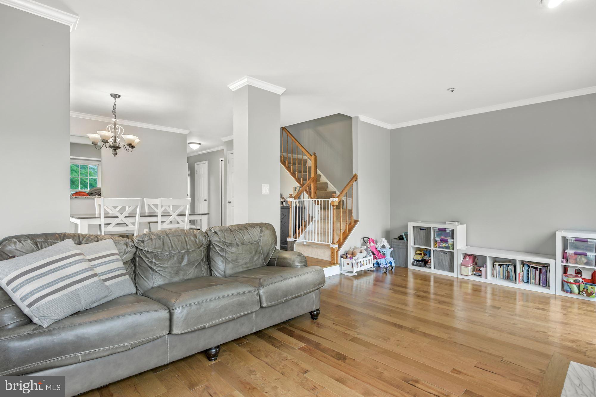 20121 Crew Square Ashburn, VA 20147 - Photo 19 of 36 a living room with furniture and a wooden floor