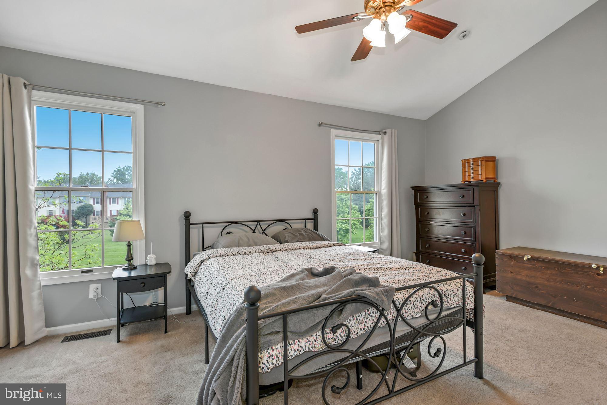 20121 Crew Square Ashburn, VA 20147 - Photo 20 of 36 a bedroom with a bed and a window