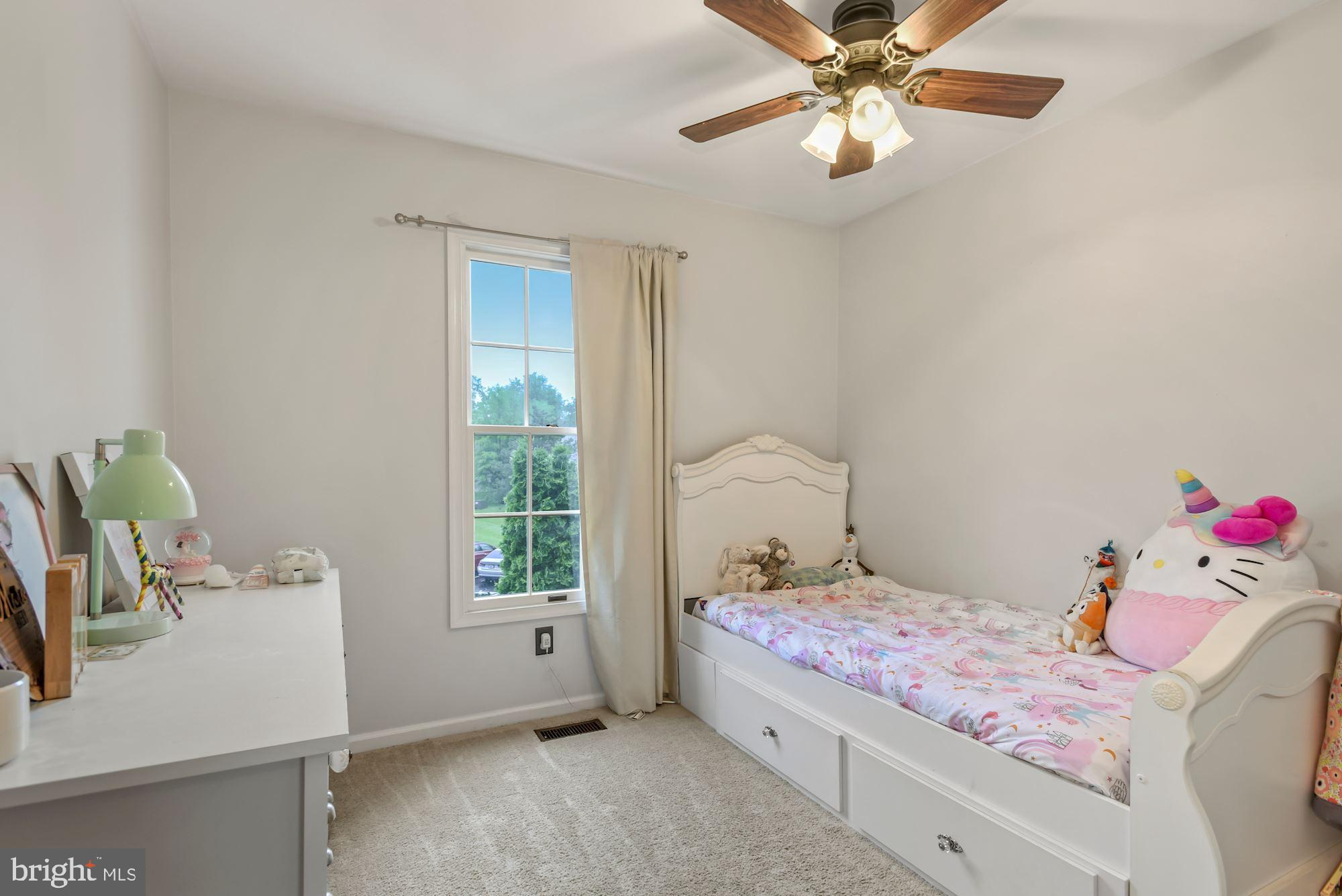 20121 Crew Square Ashburn, VA 20147 - Photo 25 of 36 a bedroom with a bed and a chandelier