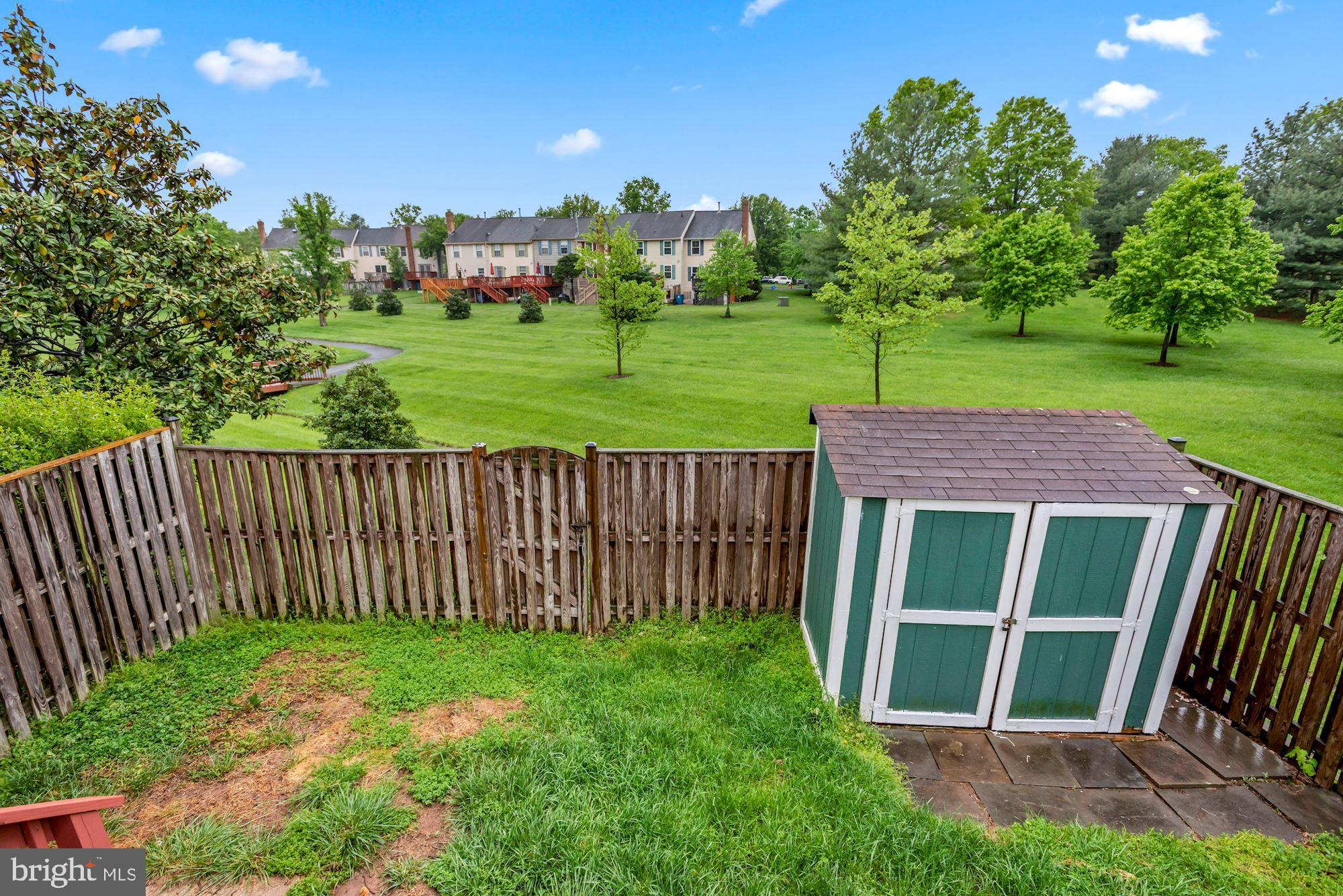 20121 Crew Square Ashburn, VA 20147 - Photo 33 of 36 a view of a backyard with a garden