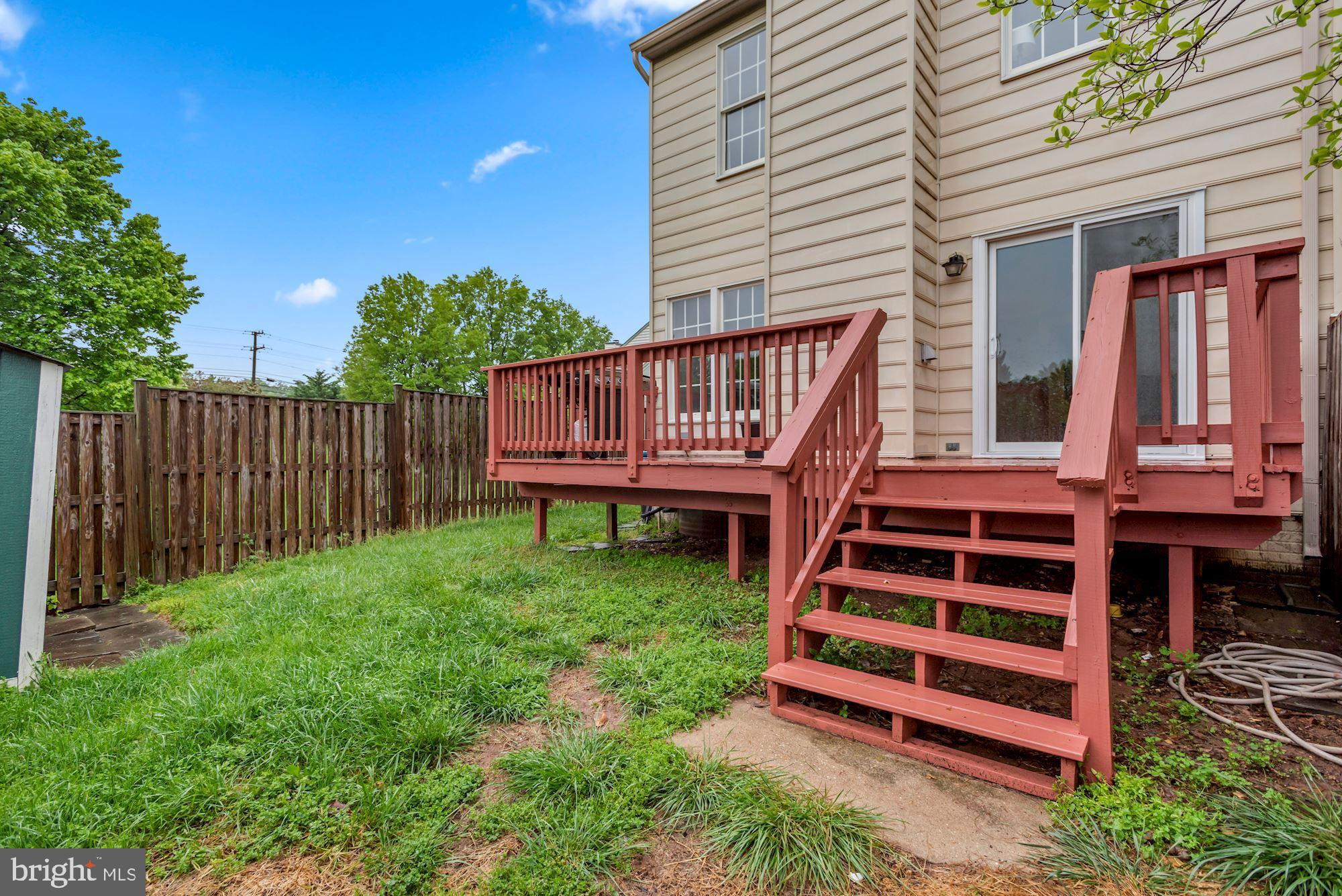 20121 Crew Square Ashburn, VA 20147 - Photo 36 of 36 a view of a backyard with a deck