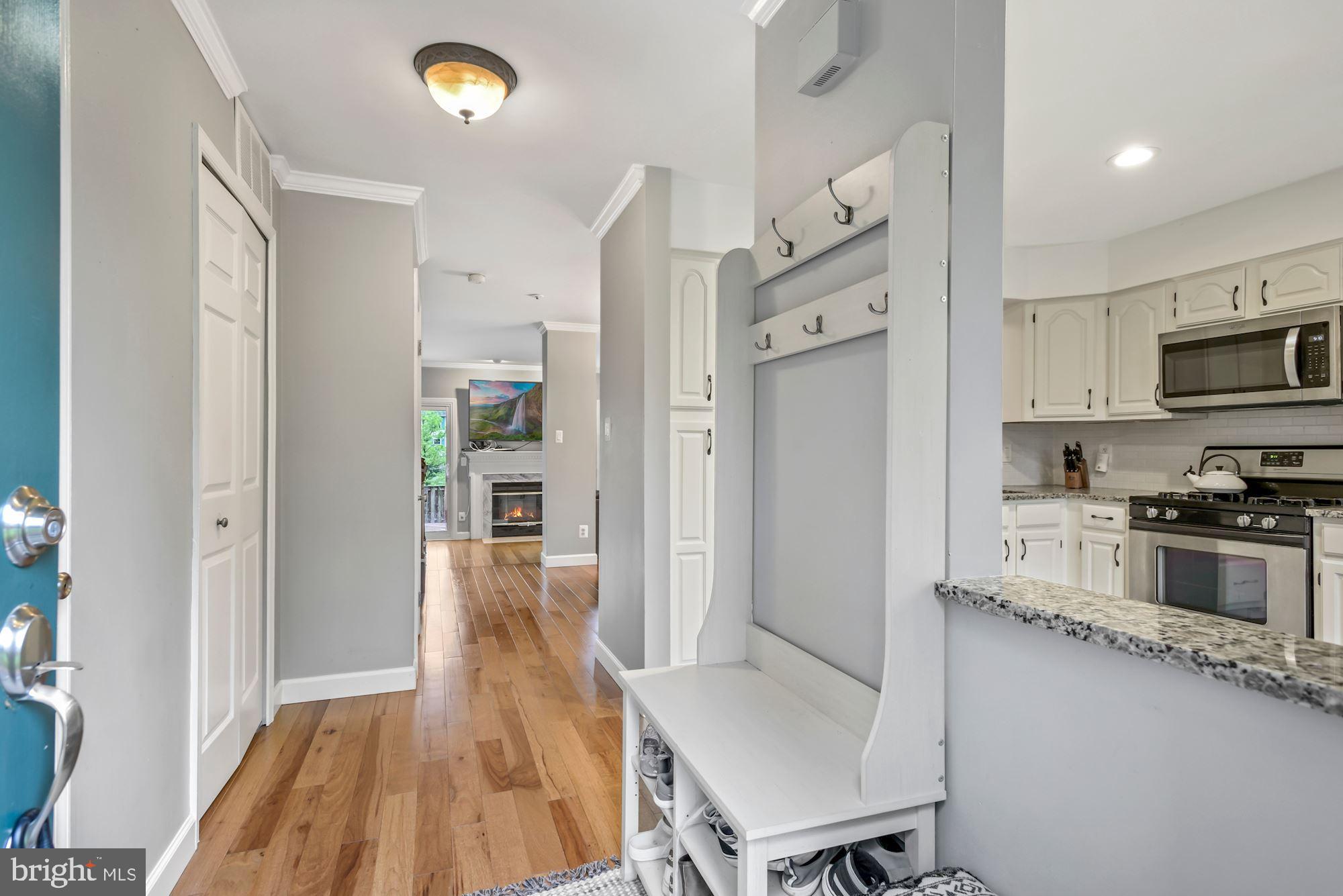 20121 Crew Square Ashburn, VA 20147 - Photo 5 of 36 a kitchen with stainless steel appliances granite countertop a refrigerator and a stove top oven