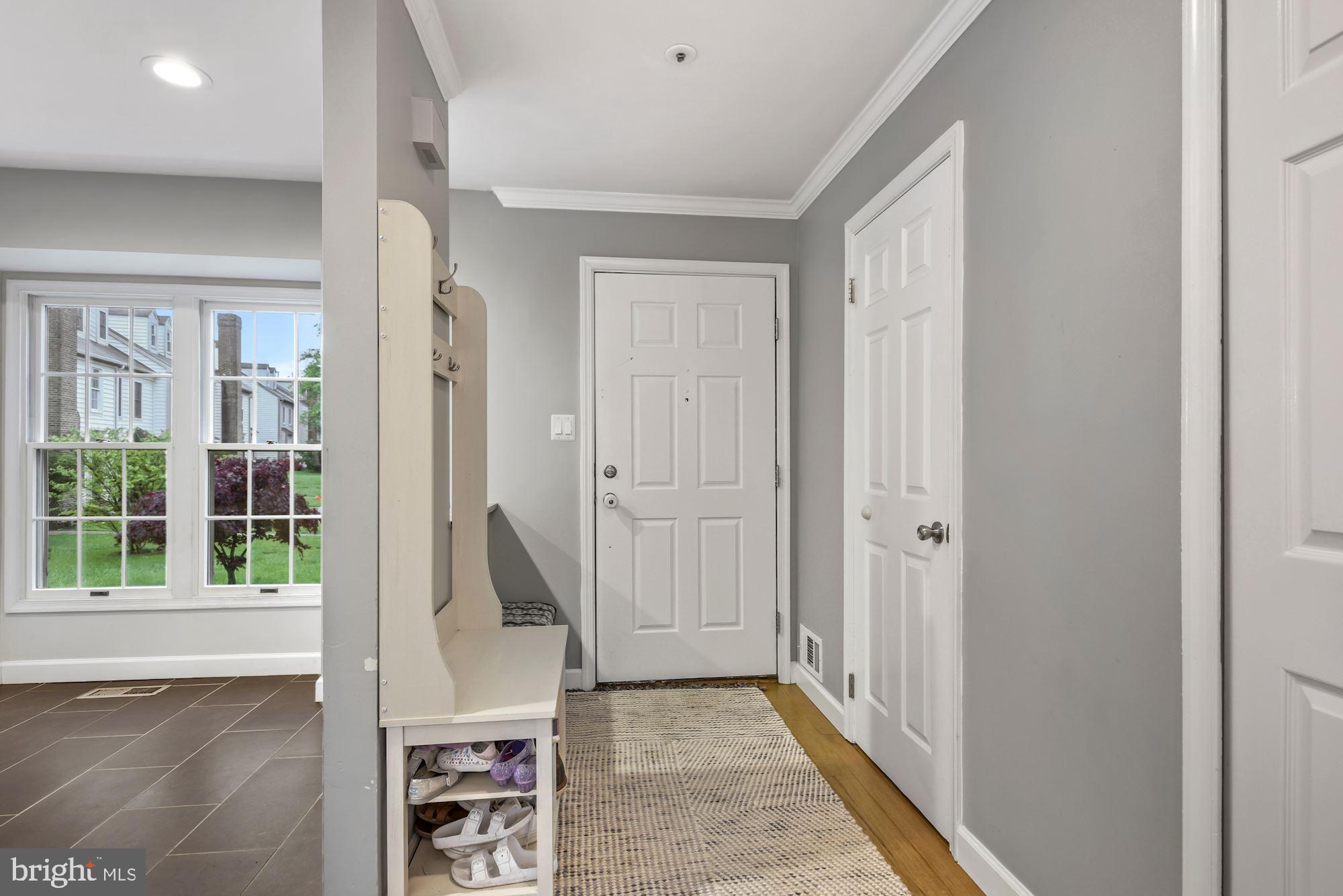 20121 Crew Square Ashburn, VA 20147 - Photo 6 of 36 a view of a hallway with wooden floor and entryway