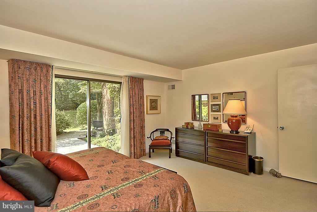 11304 Harborside Cluster Reston, VA 20191 - Photo 13 of 28 MASTER BEDROOM OPENS TO REAR DECK