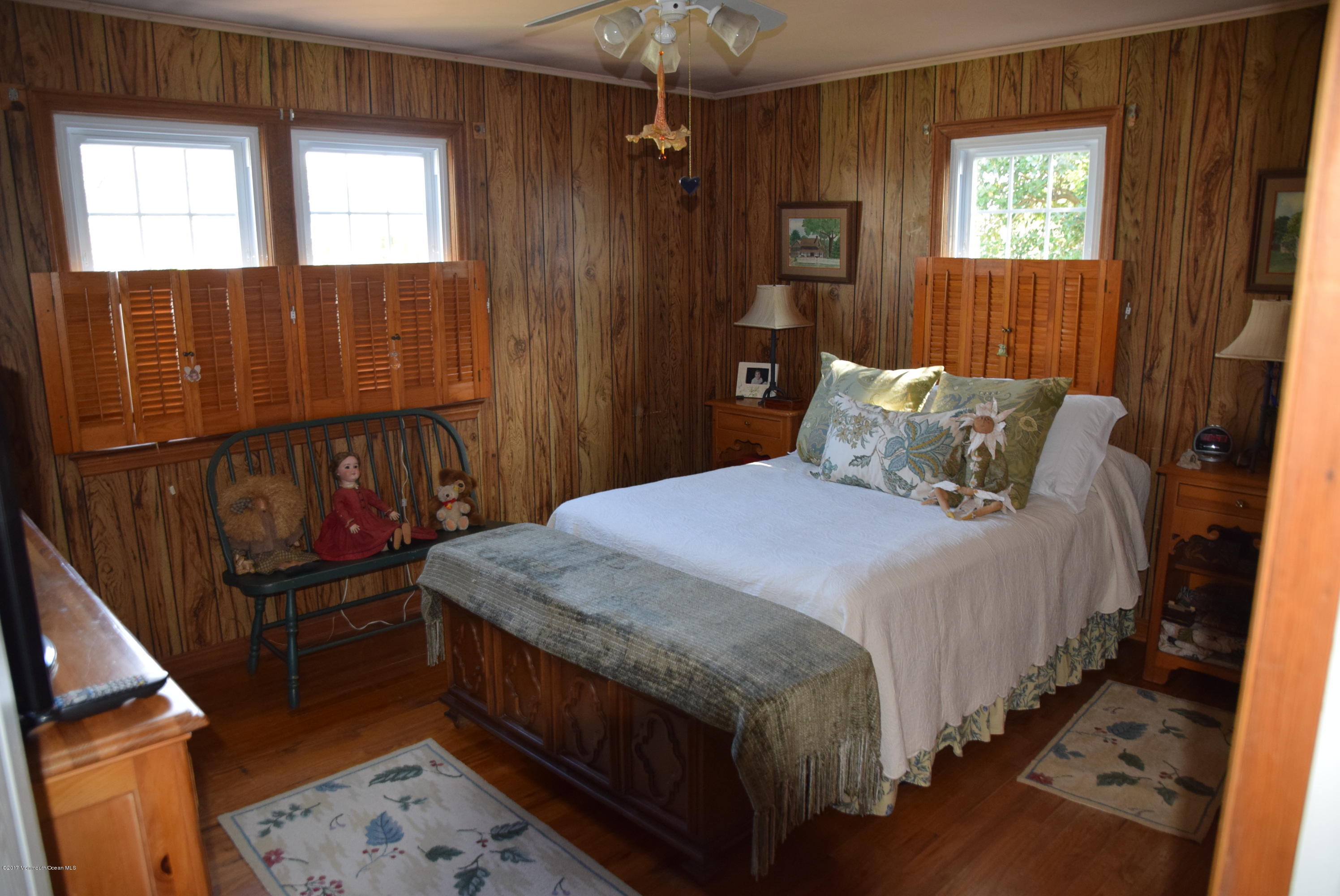 51 Narrumson Road Manasquan, NJ 08736 - Photo 11 of 17 a bedroom with a bed a window and walk in closet