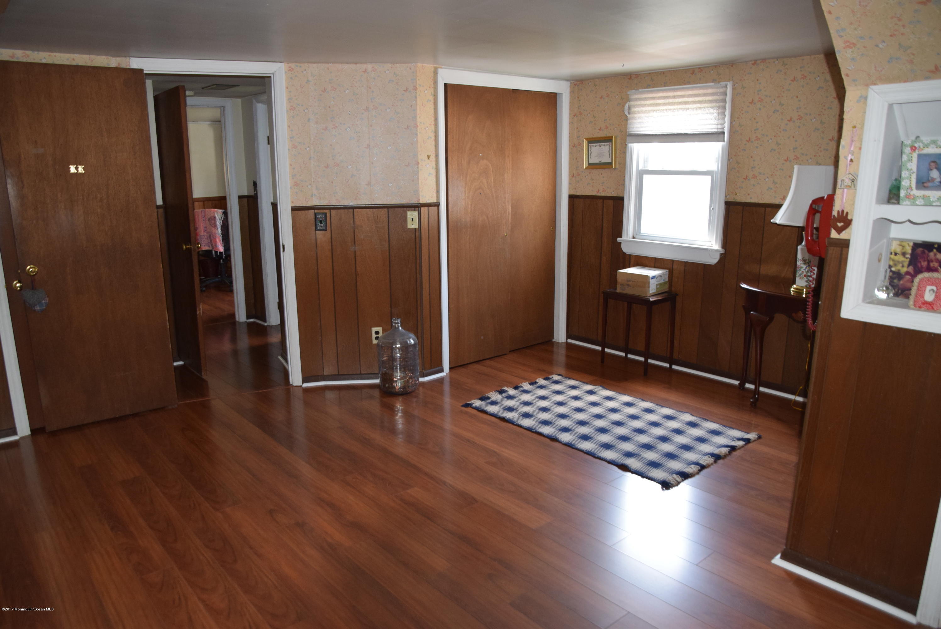 51 Narrumson Road Manasquan, NJ 08736 - Photo 14 of 17 an empty room with wooden floor and windows