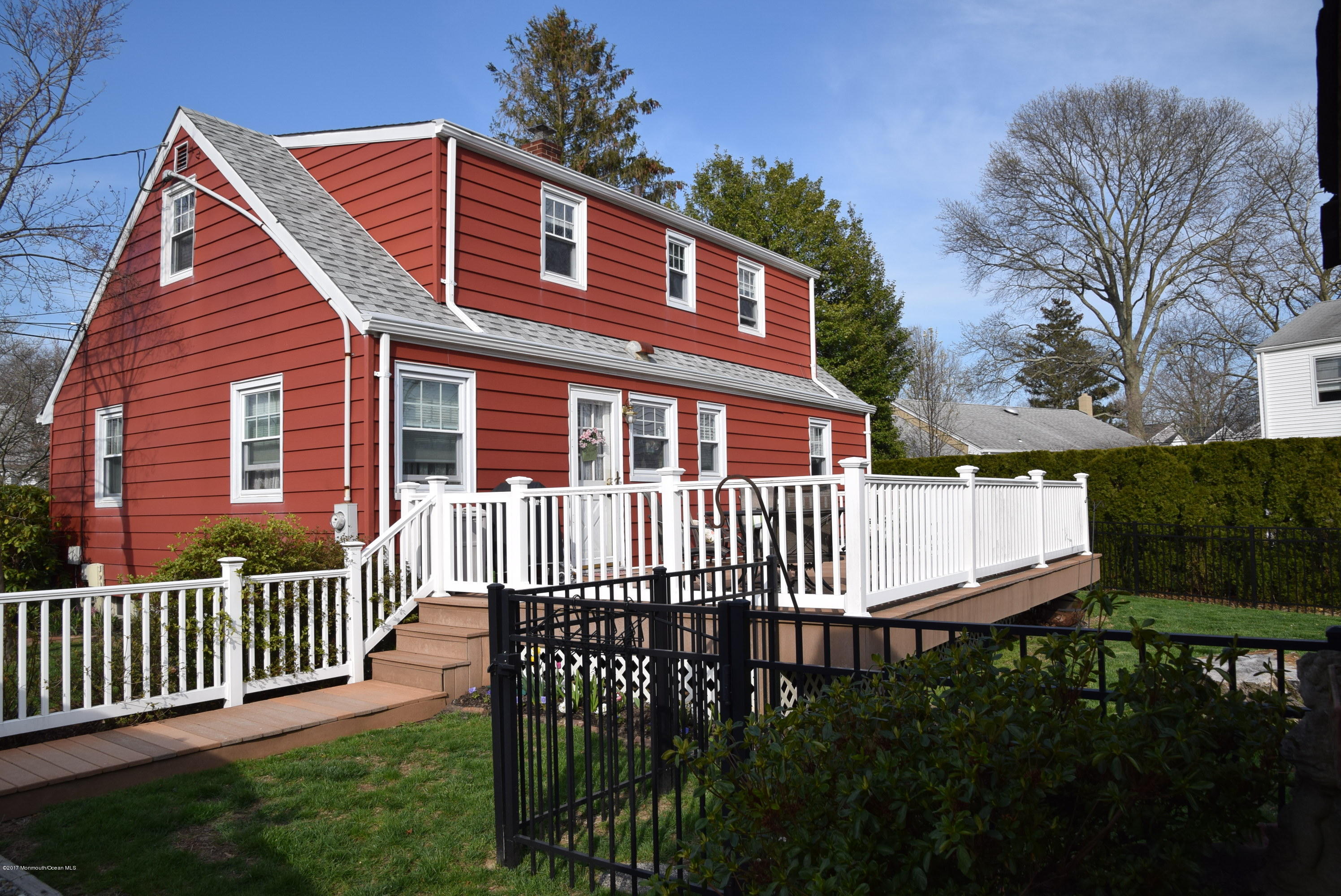 51 Narrumson Road Manasquan, NJ 08736 - Photo 2 of 17 a front view of a house with a garden