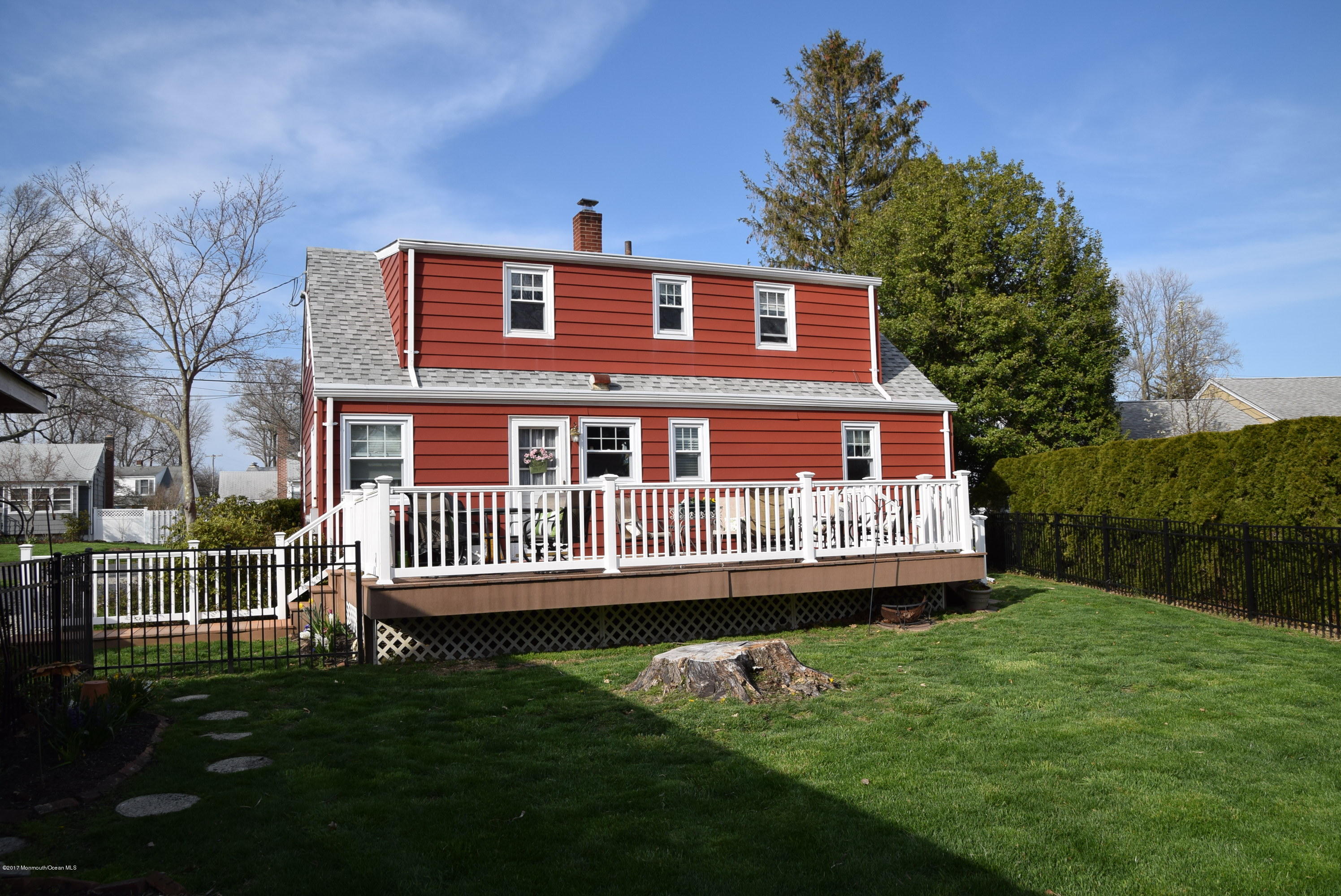 51 Narrumson Road Manasquan, NJ 08736 - Photo 4 of 17 a front view of a house with a garden