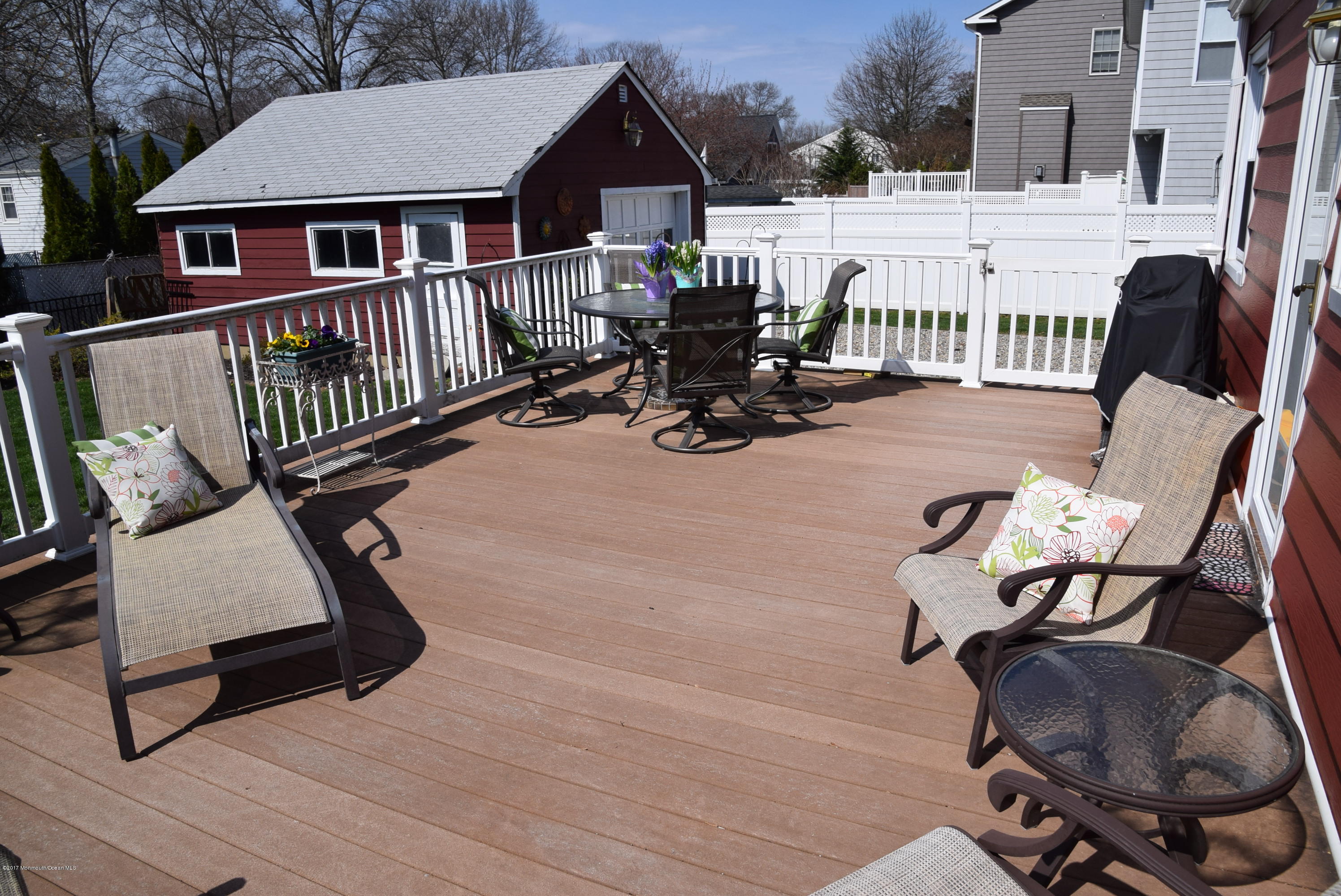 51 Narrumson Road Manasquan, NJ 08736 - Photo 5 of 17 a view of a chair and table on the wooden floor