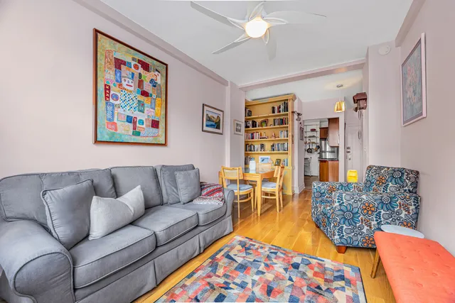 a living room with furniture and a rug