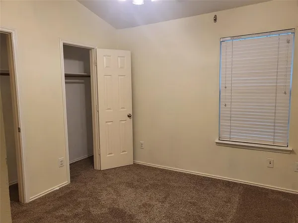 a view of a backyard with a tree