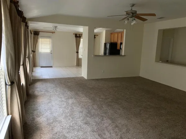 a kitchen with stainless steel appliances a refrigerator sink and cabinets