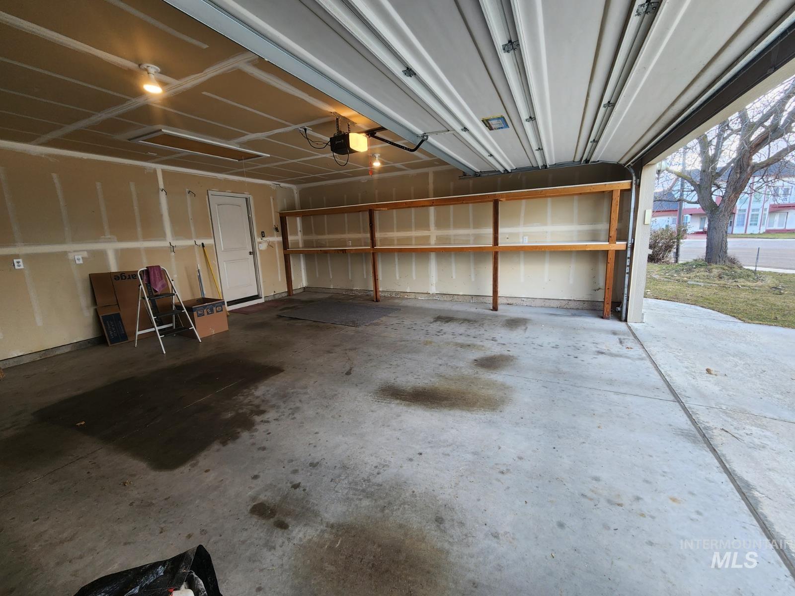 1000 North Rodeo Street Parma, ID 83660 - Photo 26 of 35 Garage featuring a garage door opener