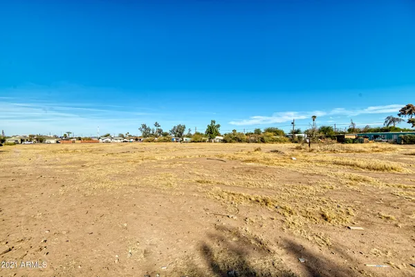 a view of a yard with an ocean