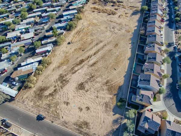 a aerial view of a brick building with many windows