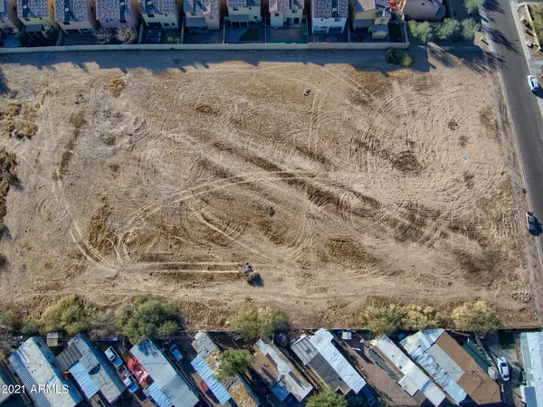 a view of a yard with trees