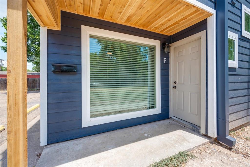 805 West Chambers Street, Unit C Cleburne, TX 76033 - Photo 1 of 12 a front view of a house with a large window