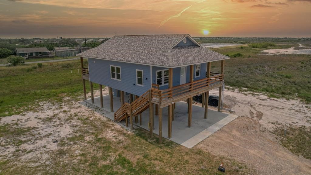 13-14 Bayview Loop Rockport, TX 78382 - Photo 2 of 26 an aerial view of house with yard and lake view