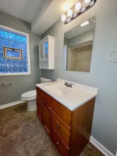 2227 Forest Avenue North Riverside, IL 60546 - Photo 6 of 12 a bathroom with a sink vanity and a toilet