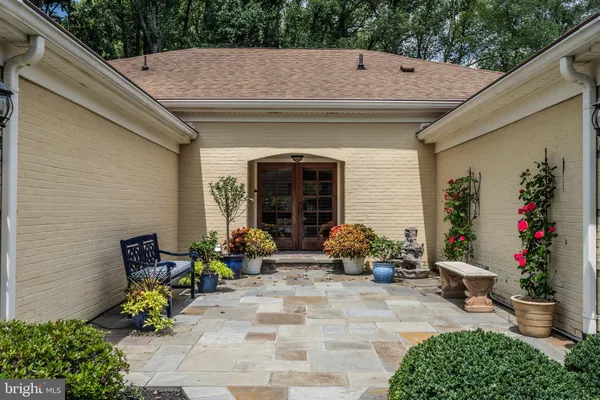 a backyard of a house with outdoor seating