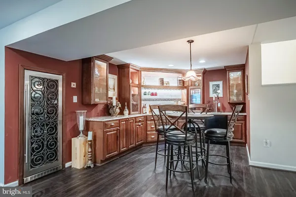 a kitchen with granite countertop a sink and a stove
