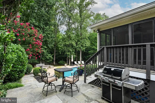 a view of a house with a yard patio and swimming pool