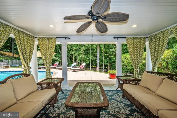 a view of a swimming pool with an outdoor seating