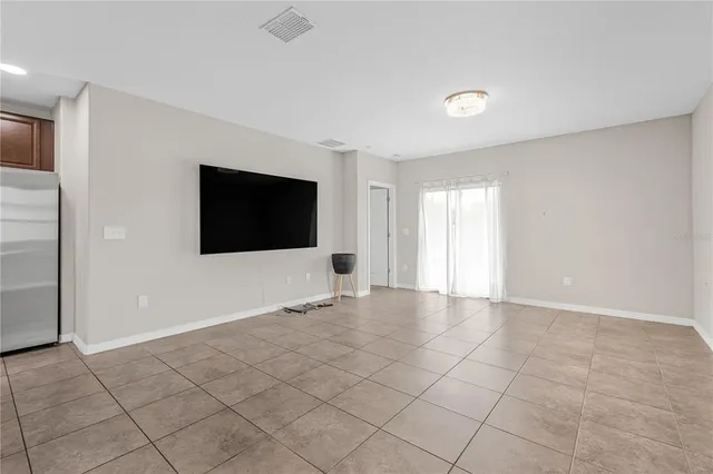 a view of an empty room with windows